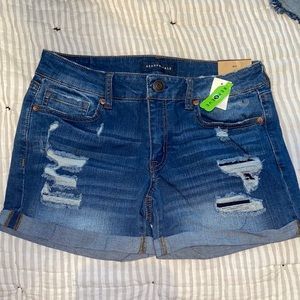 Distressed denim midi shorts